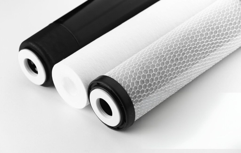 Replacement filters for a typical hydroponic reverse osmosis system. From left, the RO Membrane, Sediment Filter, and the Carbon Filter