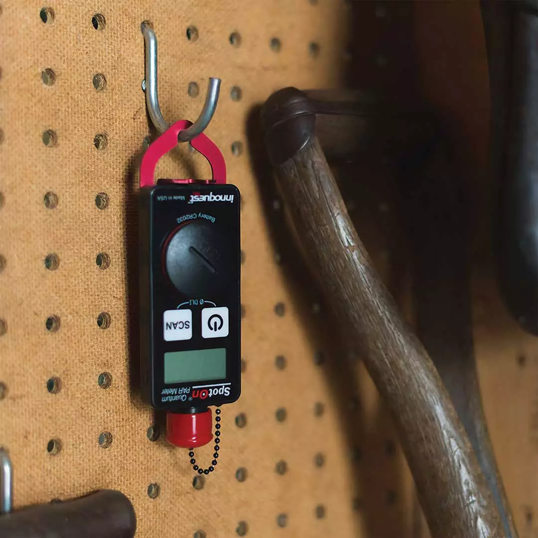 meter hanging from pegboard