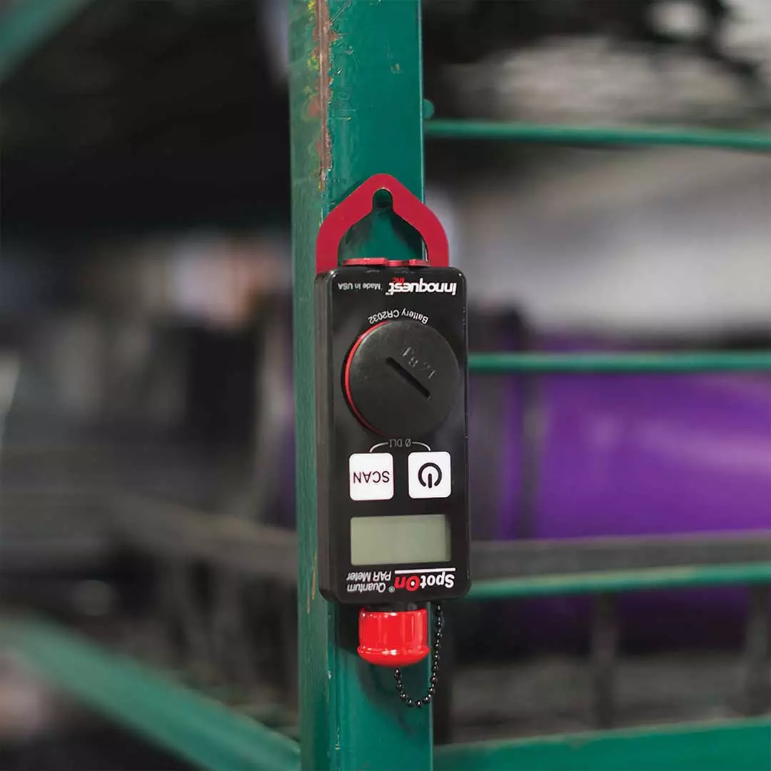 meter hanging from shelf