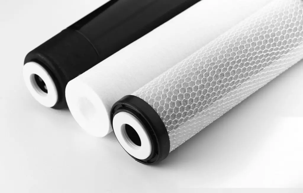 Replacement filters for a typical hydroponic reverse osmosis system. From left, the RO Membrane, Sediment Filter, and the Carbon Filter